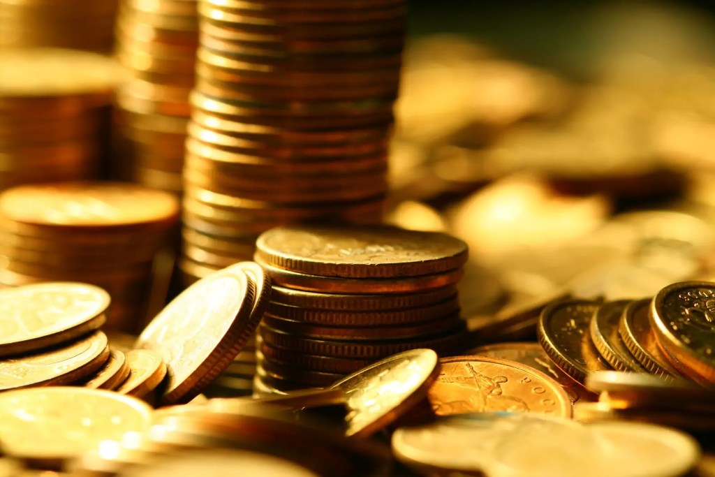 bigstock-golden-coins-macro-close-up-12457901.jpg