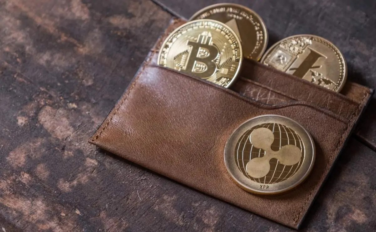 1200z740_1617708848_Popular-cryptocurrency-in-leather-wallet-on-wooden-table-top.jpg