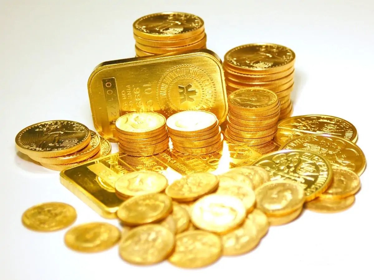 Pile_of_Gold_Bars_and_Gold_Coins.jpg