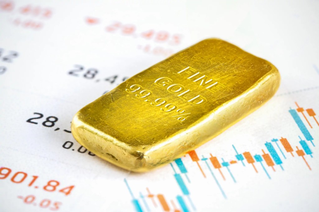 gold-bar-lies-on-a-financial-chart-1.jpg