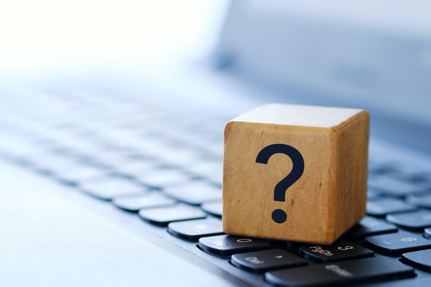 question-mark-wooden-cube-computer-keyboard-with-blurred-background-shallow-depth-field.jpg